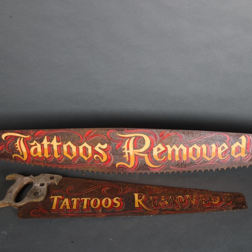 3594 - Curiosity / Macabre: Two “Tattoos Removed” Saw's. A large vintage weathered two man crosscut hand sa... 