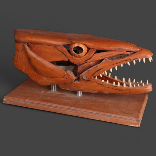 3596 - Clive Fredriksson - a handmade wooden sculpture, study of a Barracuda head, mouth open, resting on w... 