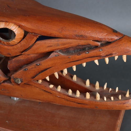 3596 - Clive Fredriksson - a handmade wooden sculpture, study of a Barracuda head, mouth open, resting on w... 