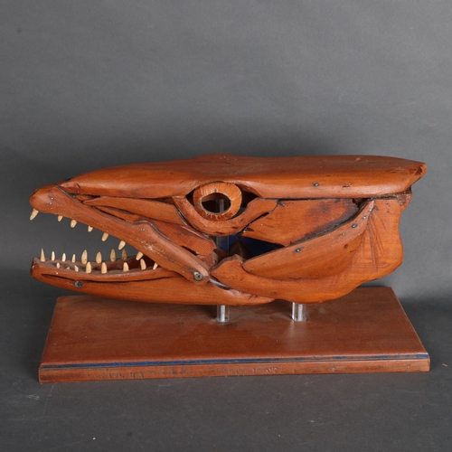 3596 - Clive Fredriksson - a handmade wooden sculpture, study of a Barracuda head, mouth open, resting on w... 