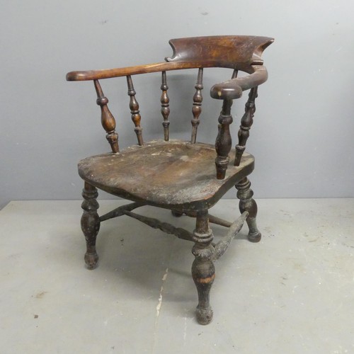 2561 - An elm-seated smoker's bow arm chair.