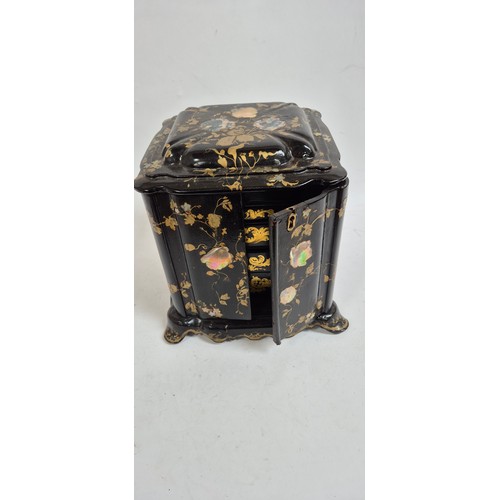 1 - A 19th century papier mache travelling writing/jewellery box, with lid opening to reveal a red velve... 