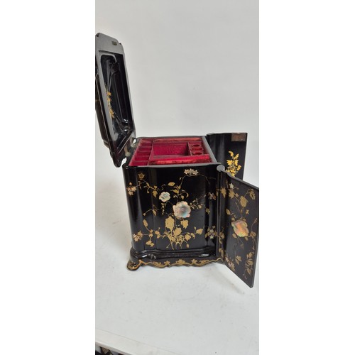 1 - A 19th century papier mache travelling writing/jewellery box, with lid opening to reveal a red velve... 