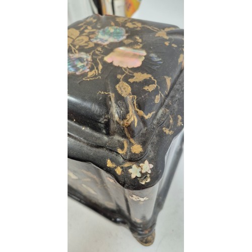 1 - A 19th century papier mache travelling writing/jewellery box, with lid opening to reveal a red velve... 