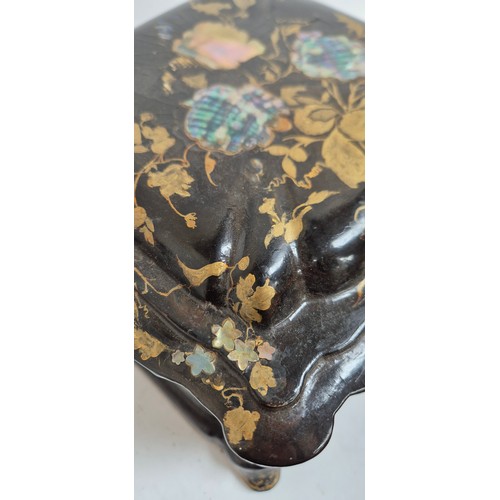 1 - A 19th century papier mache travelling writing/jewellery box, with lid opening to reveal a red velve... 