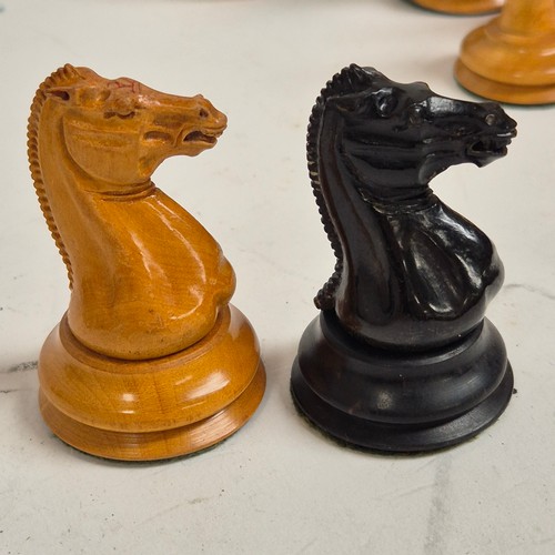 147 - A boxwood and ebony chess set, comprising Staunton and Jacques pieces, King height 8.7cm