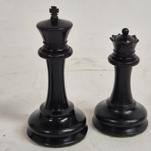 147 - A boxwood and ebony chess set, comprising Staunton and Jacques pieces, King height 8.7cm