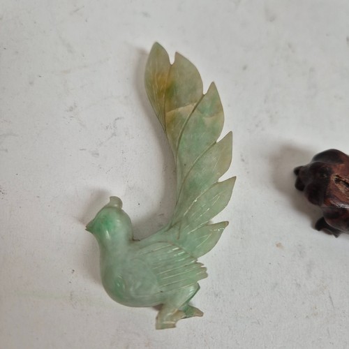 159 - A pair of Chinese carved jadeite birds on stands, and a quartz dog of fo (3)