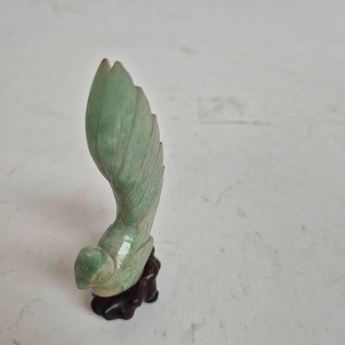 159 - A pair of Chinese carved jadeite birds on stands, and a quartz dog of fo (3)