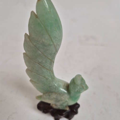 159 - A pair of Chinese carved jadeite birds on stands, and a quartz dog of fo (3)