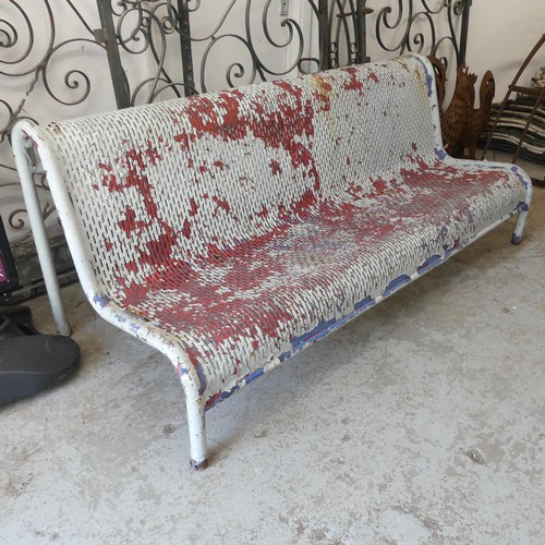 2989 - A vintage weathered and white painted metal British Rail station bench. Overall 183x75x80cm.