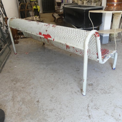 2989 - A vintage weathered and white painted metal British Rail station bench. Overall 183x75x80cm.