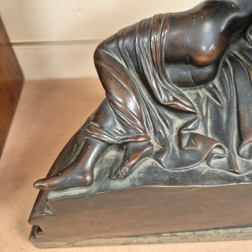 86 - A cast-bronze study of Cupid and Psyche, mounted on a green marble base of demi-lune form, H40cm