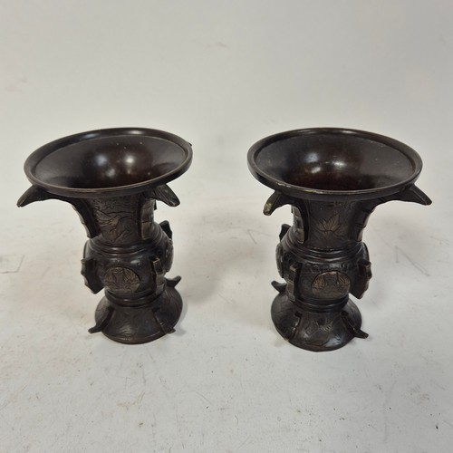 228 - A pair of Japanese temple vases, with raised and engraved decoration, H13cm