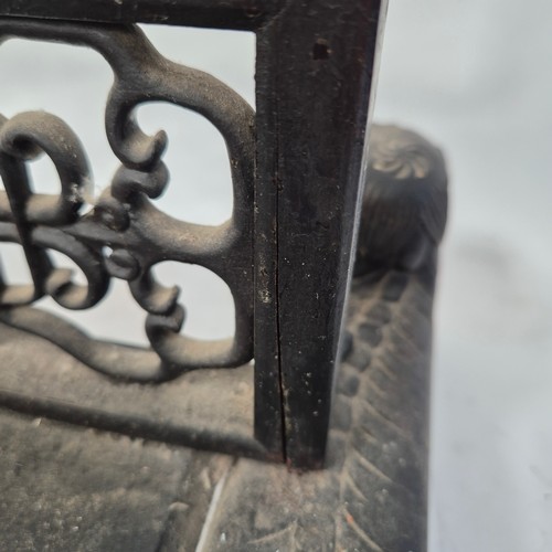 225 - An Oriental carved and pierced hardwood stand, raised on dog of fo supports, W55cm