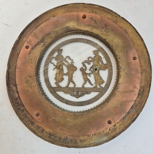 247 - An Antique circular brass and glass plaque, with applied swag and rose decoration and Grecian figure... 