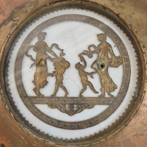 247 - An Antique circular brass and glass plaque, with applied swag and rose decoration and Grecian figure... 