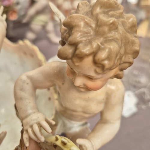 386 - A large quantity of 19th century Continental porcelain ware, various cherub decoration, and includin... 