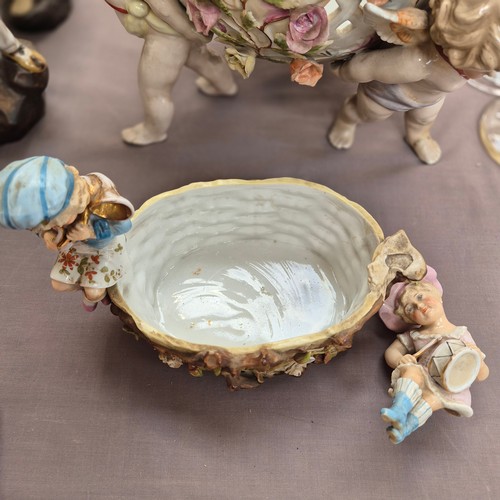 386 - A large quantity of 19th century Continental porcelain ware, various cherub decoration, and includin... 