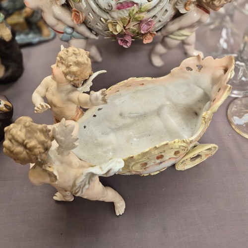 386 - A large quantity of 19th century Continental porcelain ware, various cherub decoration, and includin... 