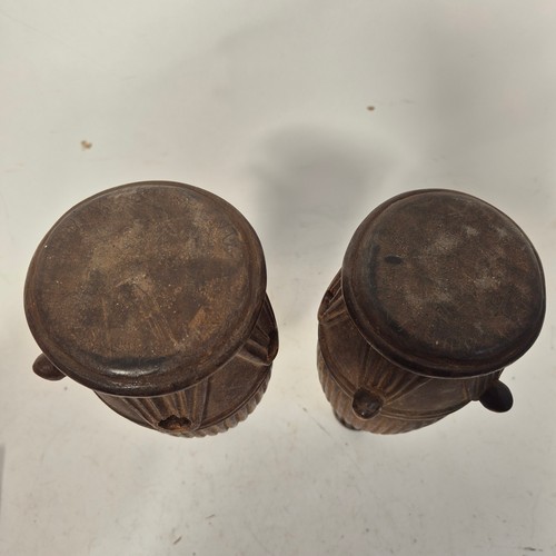 3469 - A pair of African tribal ceremonial carved wood representations of drums, indistinct inscriptions to... 