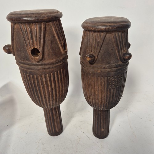 3469 - A pair of African tribal ceremonial carved wood representations of drums, indistinct inscriptions to... 