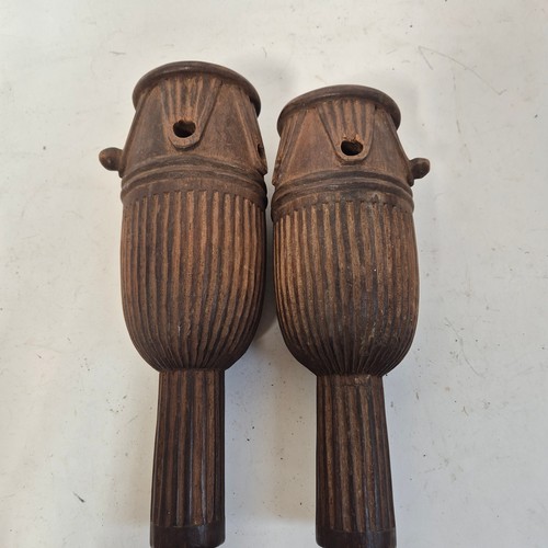 3469 - A pair of African tribal ceremonial carved wood representations of drums, indistinct inscriptions to... 