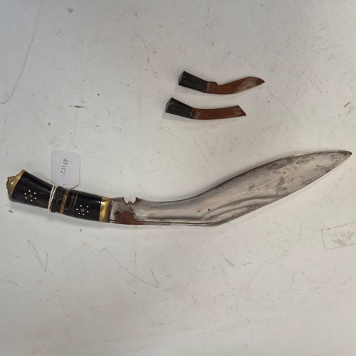 199 - A Nepalese kukri knife and scabbard, brass and horn handle, including 2 small knives