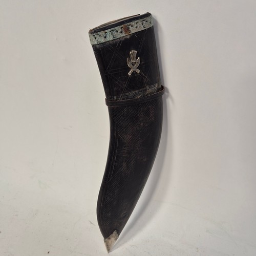 199 - A Nepalese kukri knife and scabbard, brass and horn handle, including 2 small knives