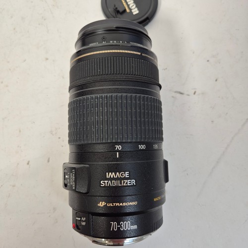 355 - A Canon EO5500D, and associated Canon zoom lenses, and a Sigma zoom lens 28-200mm, in original packa... 