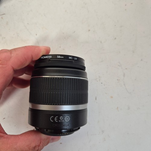 355 - A Canon EO5500D, and associated Canon zoom lenses, and a Sigma zoom lens 28-200mm, in original packa... 