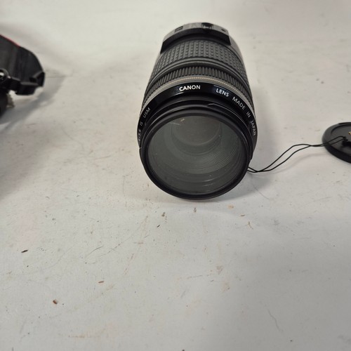 355 - A Canon EO5500D, and associated Canon zoom lenses, and a Sigma zoom lens 28-200mm, in original packa... 