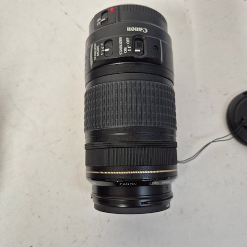 355 - A Canon EO5500D, and associated Canon zoom lenses, and a Sigma zoom lens 28-200mm, in original packa... 