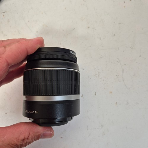 355 - A Canon EO5500D, and associated Canon zoom lenses, and a Sigma zoom lens 28-200mm, in original packa... 