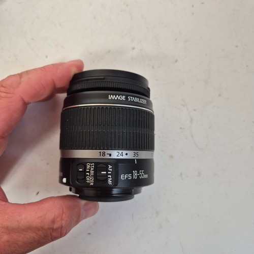 355 - A Canon EO5500D, and associated Canon zoom lenses, and a Sigma zoom lens 28-200mm, in original packa... 