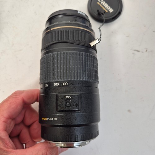 355 - A Canon EO5500D, and associated Canon zoom lenses, and a Sigma zoom lens 28-200mm, in original packa... 