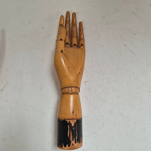 3524 - A group of three similar vintage carved wood articulated artist's hands, largest, height 30cm, (3)