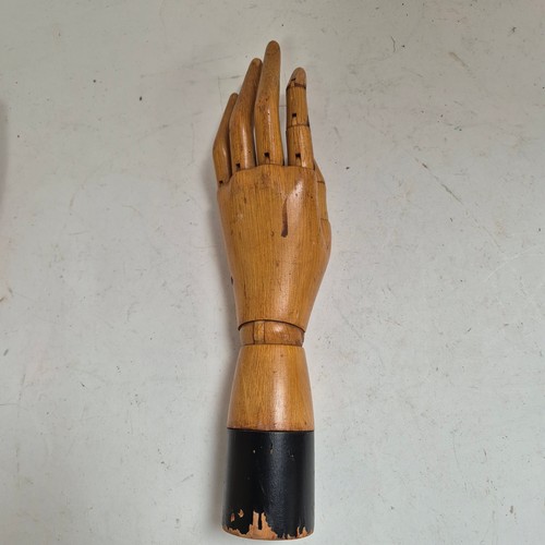 3524 - A group of three similar vintage carved wood articulated artist's hands, largest, height 30cm, (3)