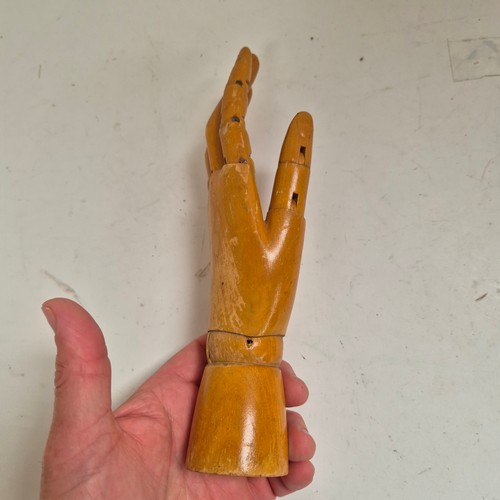 3524 - A group of three similar vintage carved wood articulated artist's hands, largest, height 30cm, (3)