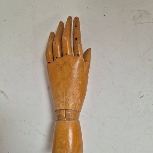 3524 - A group of three similar vintage carved wood articulated artist's hands, largest, height 30cm, (3)