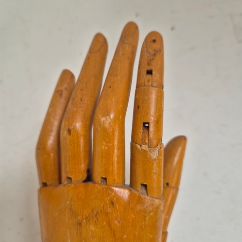 3524 - A group of three similar vintage carved wood articulated artist's hands, largest, height 30cm, (3)