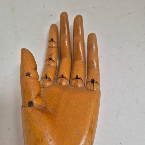 3524 - A group of three similar vintage carved wood articulated artist's hands, largest, height 30cm, (3)