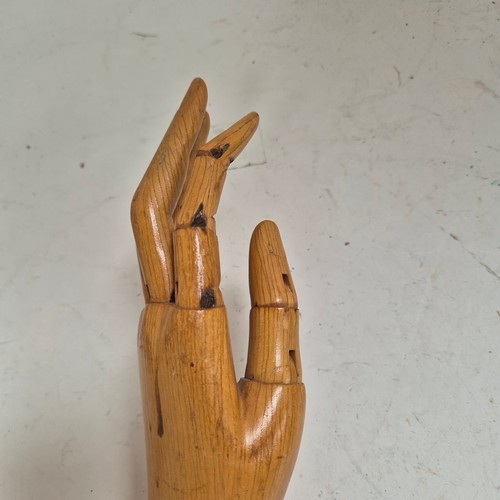 3524 - A group of three similar vintage carved wood articulated artist's hands, largest, height 30cm, (3)