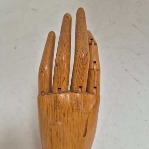 3524 - A group of three similar vintage carved wood articulated artist's hands, largest, height 30cm, (3)