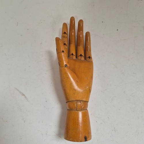 3524 - A group of three similar vintage carved wood articulated artist's hands, largest, height 30cm, (3)