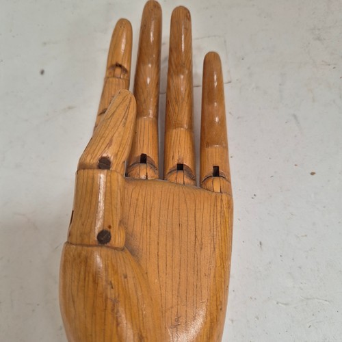 3524 - A group of three similar vintage carved wood articulated artist's hands, largest, height 30cm, (3)