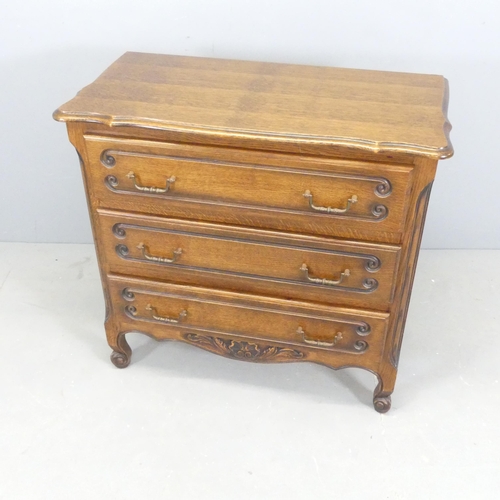 2349 - A French oak chest of three long drawers, with carved decoration. 85x81x43cm.