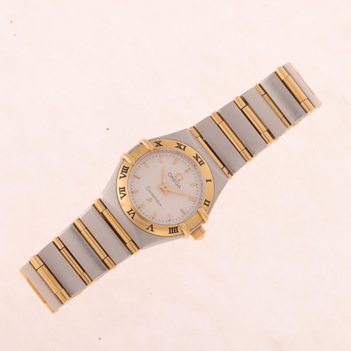 1031 - OMEGA - a lady's stainless steel and gold Constellation quartz bracelet watch, ref. 795.1203, circa ... 