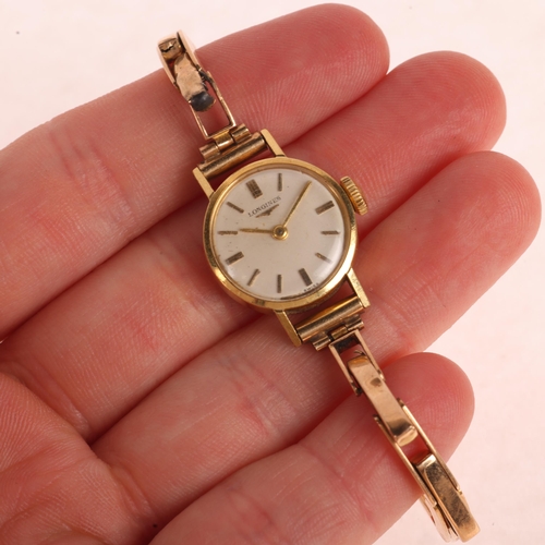 1039 - LONGINES - a lady's 18ct gold mechanical bracelet watch, circa 1960s, silvered dial with applied gil... 