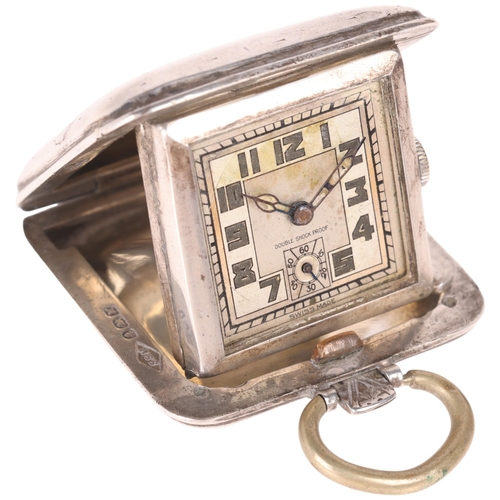 1045 - An Art Deco silver travelling purse watch, by Sapho, silvered dial with Arabic numerals, blued steel... 